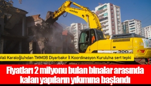 Fiyatları 2 milyonu bulan binalar arasında kalan yapıların yıkımına başlandı